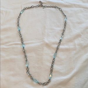 Silver colored chain with light blue stones.